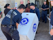 2 Members of Estero Fire Rescue unloading the toys from the trailer.